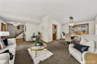 Living and formal dining flow into each other for seamless hosting, etc.