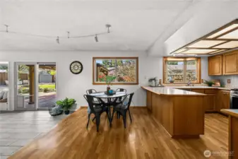 Open concept floorplan has kitchen, informal dining, and family room flowing into eachother.