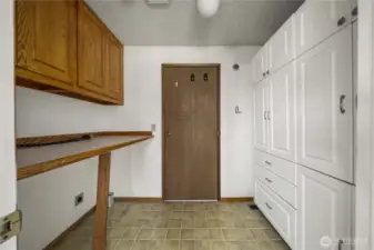 Mudroom / laundry area with tons of storage space.
