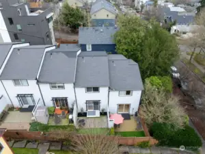 Arial photo of the Madison Valley East Townhomes; view of the south-facing patio & yards. Unit 2 is the second unit from the right.