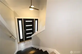 Gorgeous modern entryway lets in lots of natural light.