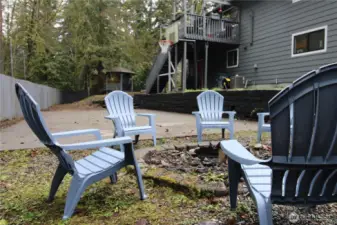 The backyard has a basketball court and fire pit waiting for you this summer.