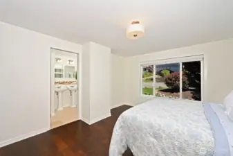 Retreat your upgraded primary suite with its renovated full bath & walk-in closet.