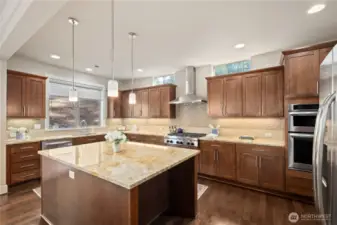 Sellers chose upgraded granite countertops, under counter lighting and back splash for a true luxurious feeling