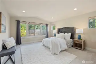 Enormous primary suite with a walk-in closet and 5-piece bathroom