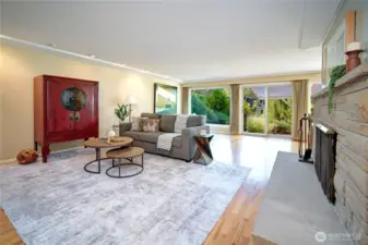 Hardwood floors flow through the main spaces, complemented by two fireplaces. Great open spaces for entertaining.
