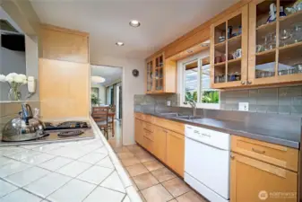 Completely remodeled kitchen with beautiful tile work, cabinetry and countertops. Eating bar-great for entertaining!