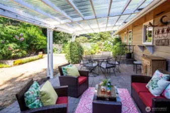 The backyard is retreat-like. Lush gardens and large covered patio extends the living space.