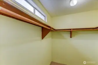 Primary walk-in closet with privacy window. Nice!!