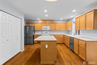 Yet another casual dining area located between the kitchen and family room has a slider to the rear yard for easy summertime entertaining