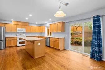 Yet another casual dining area located between the kitchen and family room has a slider to the rear yard for easy summertime entertaining