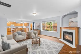 Family room empty, shows off the warm hardwood floors