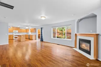Family room empty, shows off the warm hardwood floors