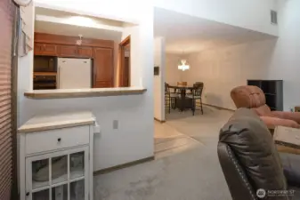 view to kitchen from LR. Slider to the deck is on the left