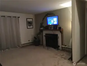 Unit 12724 - Living room with wood fireplace