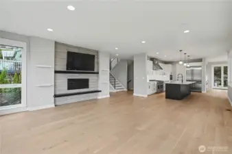 The open-concept design creates a seamless flow between the living, dining, and kitchen areas—perfect for both entertaining and daily living.