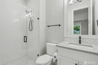Private ¾ guest bathroom conveniently connected to the bedroom, offering modern finishes and comfort for visitors.