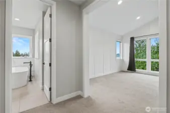 Another perspective of the primary suite highlights its thoughtful, functional layout and spacious design.