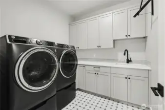 Functional yet stylish laundry room with abundant storage, a utility sink, and thoughtful design to meet all your household needs.