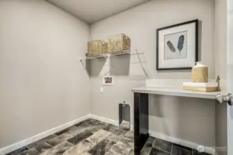 Laundry room conveniently located upstairs near bedrooms and bath! Photos are for representational purposes only.  Colors and finishes may vary.