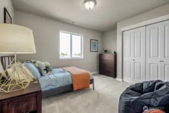 Generous secondary bedroom. Photos are for representational purposes only.  Colors and finishes may vary.