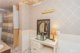 Dressing area of the bathroom, or make it what you like. Ceiling had a leak long ago and was left unfinished by handyman. Elderly owner is not able to do repairs. Being sold as-is.