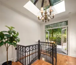 Details count-wrought iron staircase, an atrium feel of light and french doors opening to the vstone terraces-it's a wow