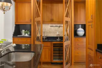 Beverage refrigerator & sliding doors add versatility.