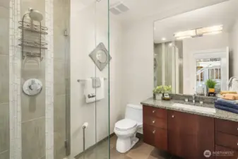 Bath is adjacent to the second bedroom on the primary level.
