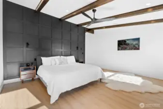 Primary suite is light-filled and spacious. Shown here with a King sized bed.
