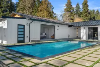 Within the courtyard is an in-ground, salt water headed pool with retractable cover and turf inlayed pavers for easy maintenance. Pool room complete with state-of-the-art pool equipment as well as ample dry storage.