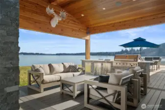 Step outside and enjoy the comfort of outdoor living with a covered Trex deck, 2-sided fireplace (so peaceful while you're in hot tub), grilling station and plenty of sun-light space for outdoor dining with a view.