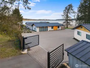 You're almost to where the magic happens. The property has been maximized to take advantage of waterfront as well as unobstructed views, with the main home being entirely on the Liberty Bay side of the property. Every roof on the estate - including the well house - has been equipped with a durable metal roof with a marine grade finish to withstand the saltwater air.
