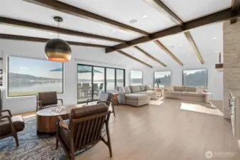 You've arrived! The open concept has been thoughtfully designed to maximize sunlight and VIEWS from every window! Living area as well as primary suite include stylish wood beams along the vaulted ceilings.