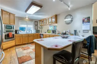 Kitchen is spacious with lots of cabinets and counter space.