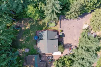 Aerial view of home with shop in the lower left and chicken coop up to the right.  Lots of room for parking, just imagine...a camper, boat, you decide.