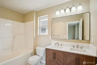 Primary bath with new vanity and flooring