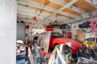 The 1.5-car garage is an absolute knockout!  Built in hoisting beam check, built in work bench check, electric shop heater check, 20 AMP outlets check, Tesla/NACS EV Charger check, NEMA 14/50 Car Charger Connector/250v Welder Plug check, high density LED lighting check!  And you will really love the 300sf of storage in the loft!