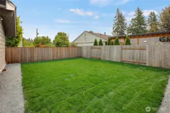 Fabulous back yard is totally flat and has brand new sod!