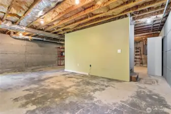 The basement, accessed by a stairway in the hall of the main level, has so much room for storage, it's ridiculous!