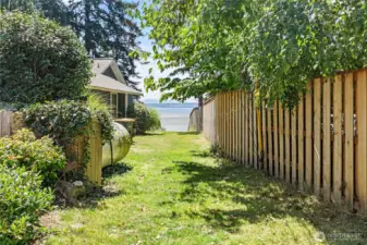 The community easement that leads directly to the beach is about a two-minute walk from the house.