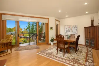 Both the living room and dining area have newly refinished bamboo floors and benefit from the double glass sliding doors out to the deck. Roller shades have been installed for sun screen when needed.