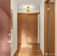 Hardwood flooring in the entry, hallway & kitchen