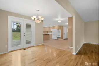 A view from the dining room towards the kitchen.  The french doors lead you to a good size deck area.
