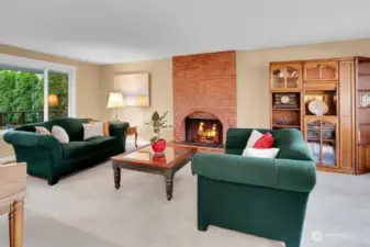 The wood burning fireplace is a major focal point of the spacious living room.