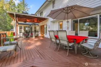 Multiple spaces for entertaining on this spacious back deck.