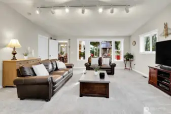 The slider off the Family room access the covered back deck and the door to the left is the spacious utility room and large 2 car garage with extra storage.