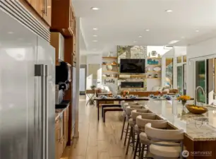 Chefs kitchen, oversized refrigerator, two ovens, warming drawer, gas stove, and 3 dishwashers