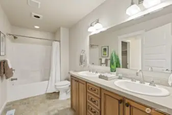 The full bathroom on the upper level is situated between Bedroom #4 and Bedroom #5 with a door into each room.