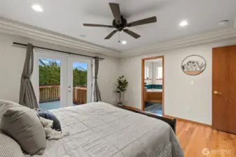 Primary bedroom refinished hardwood floors (bedroom 2)